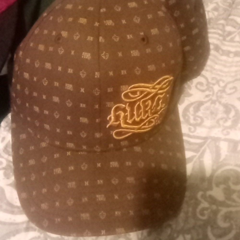 Vintage Brown flexfit hurley fitted hat.